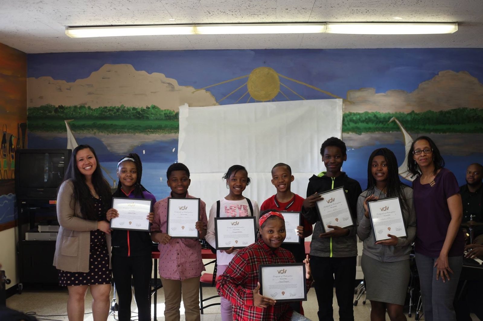 Youth receiving achievement certificates