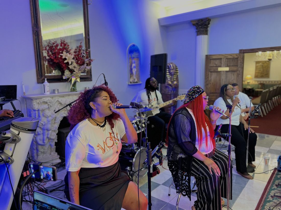 Two V.O.V singers performing together