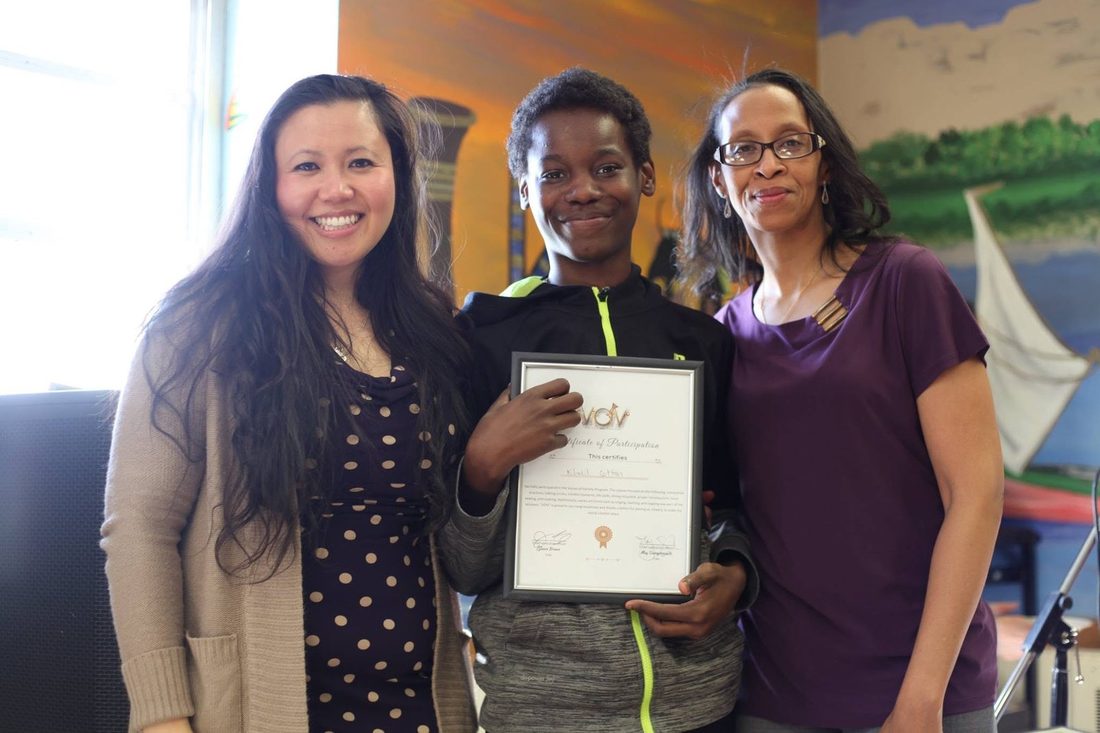 Khalil's certificate - proud and smiling