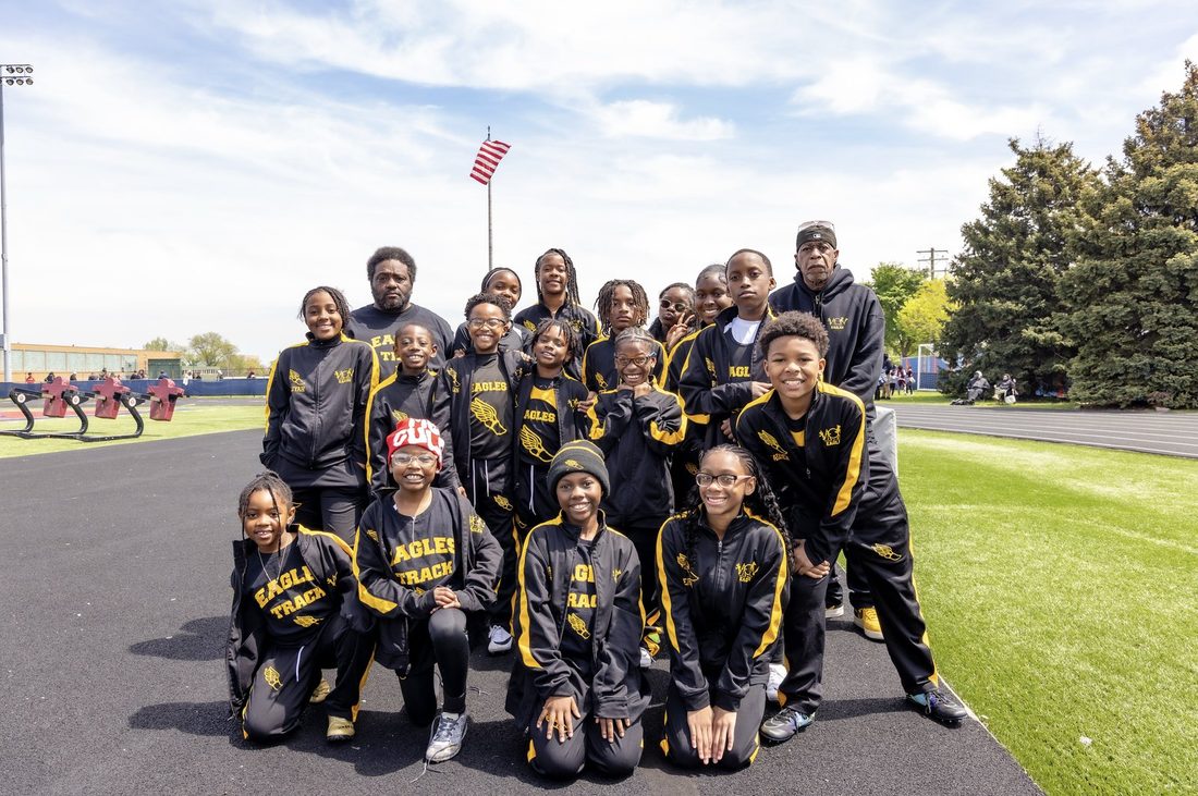 Eagles Track family - flag high, heads higher