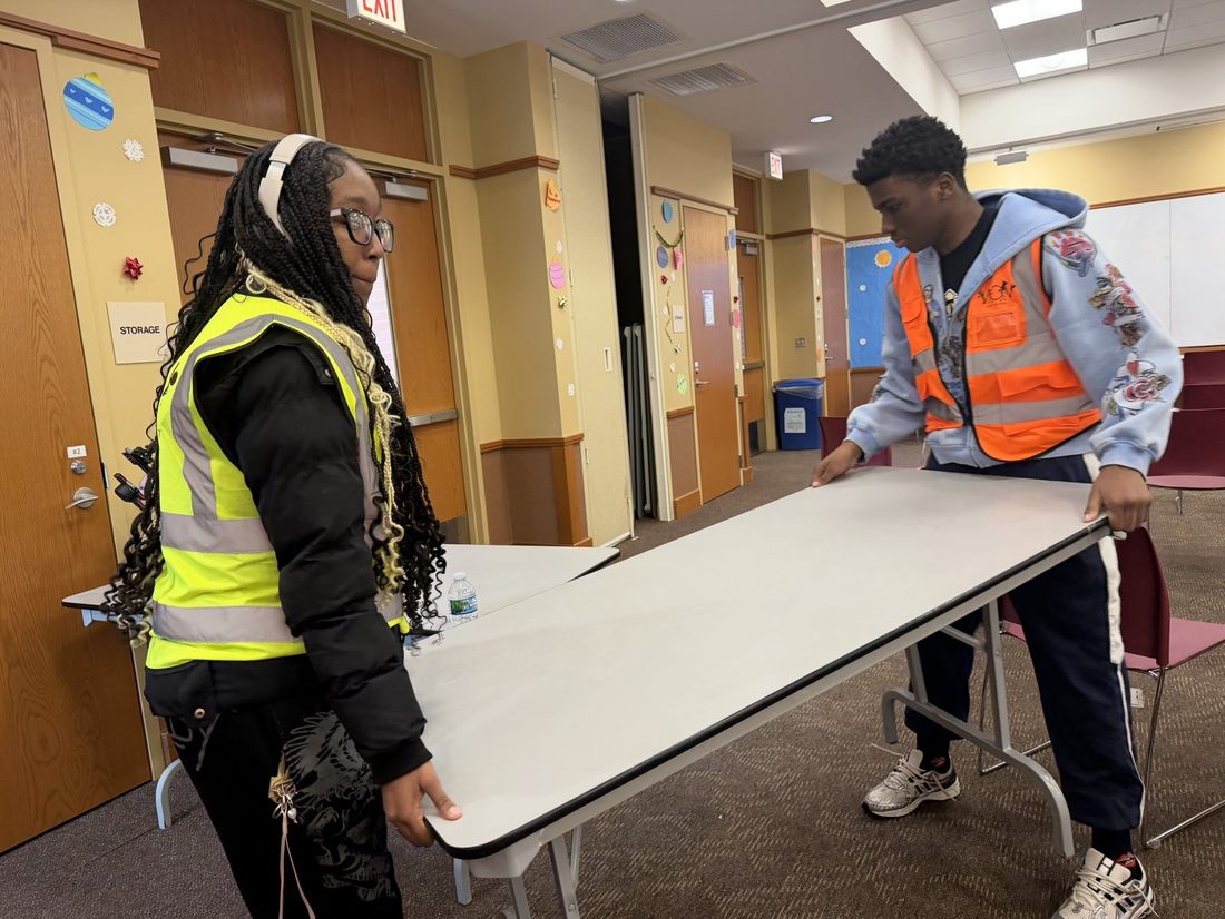 V.O.V members in safety vests setting up event tables