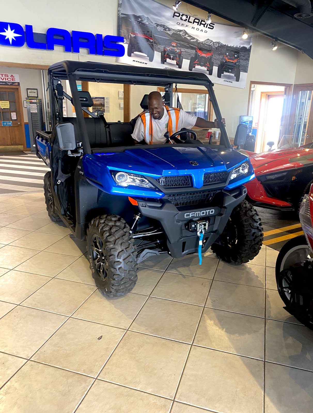 A V.O.V member checking out a new utility vehicle
