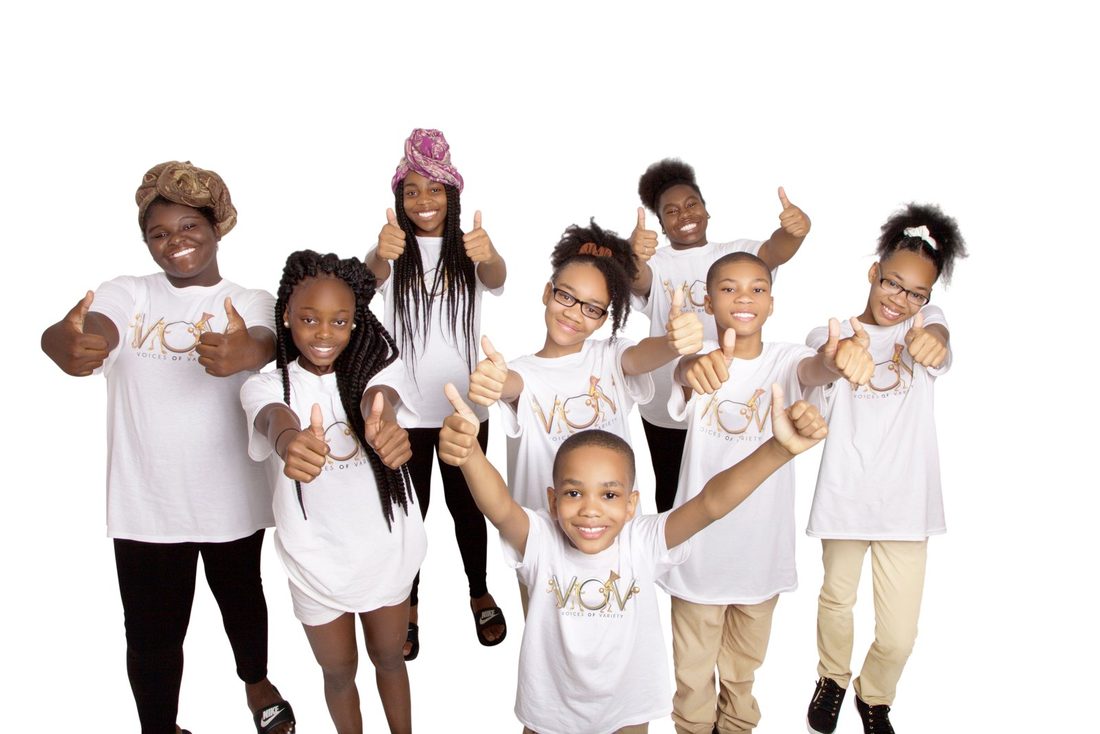 V.O.V youth in their shirts giving thumbs up